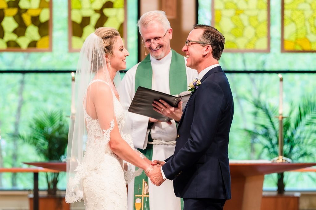 Bride and groom laughing during wedding ceremony