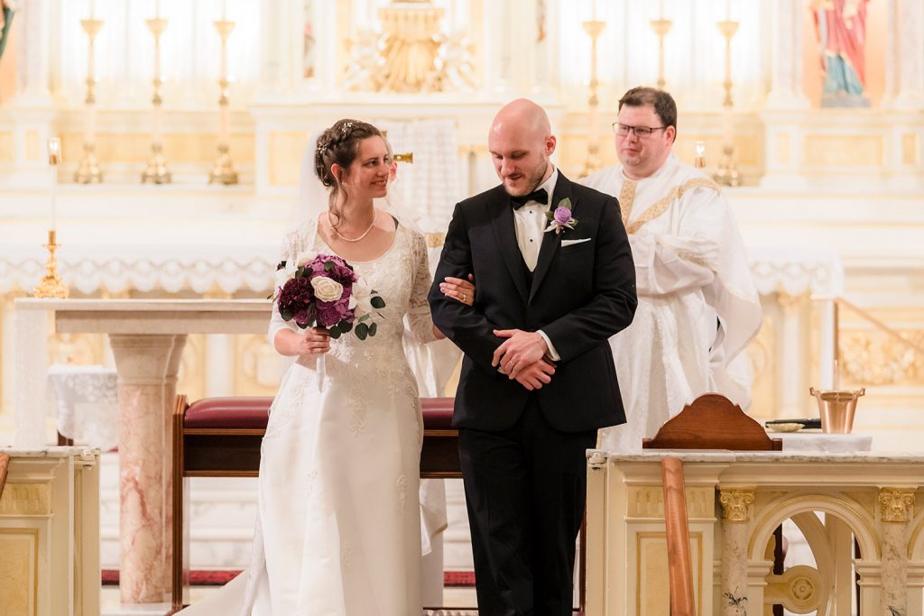 Bride and groom leave the altar at the end of their wedding ceremony