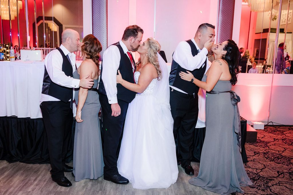 Bridal party kissing shot during the reception at Georgios Banquets in Orland Park, IL