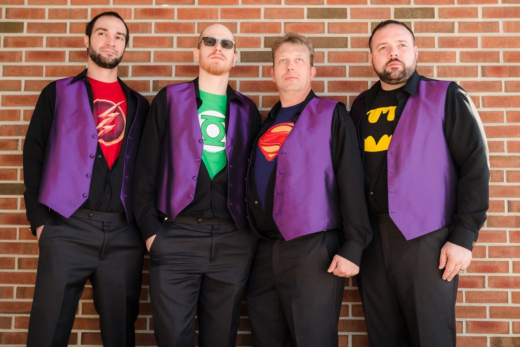 Groom and groomsmen posing as super heroes at Innsbrook Country Club in Merrillville, IN