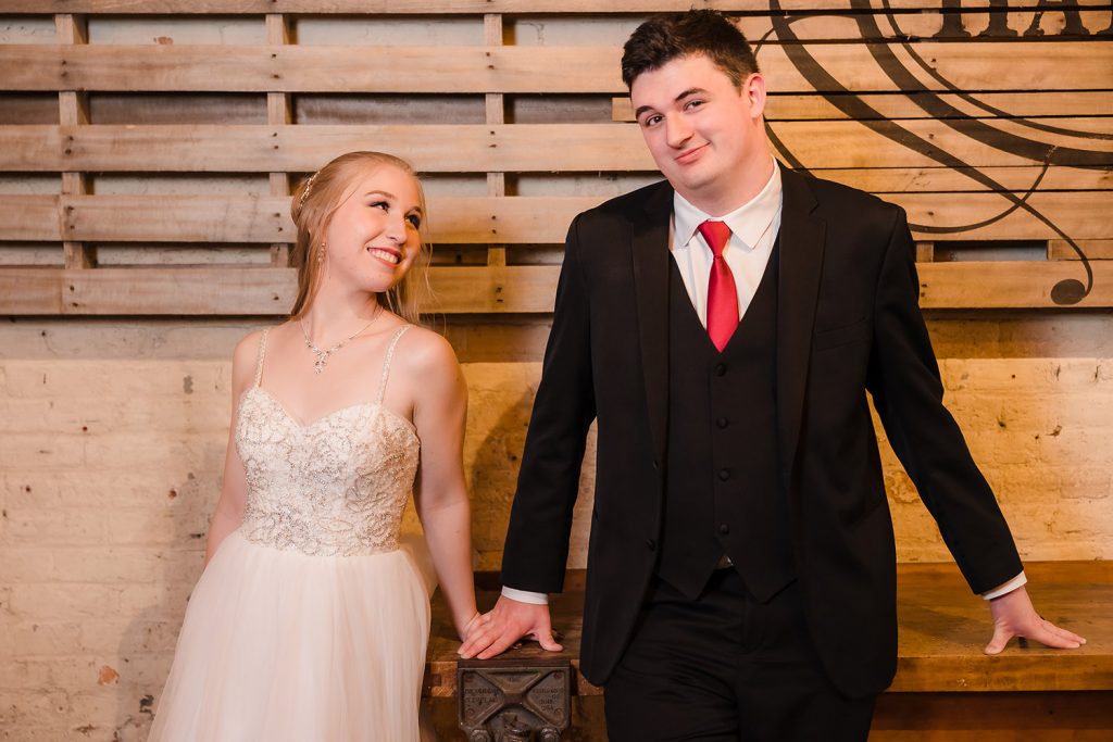 Bride and groom styled pose during their couples shoot at The Haight in Elgin, IL