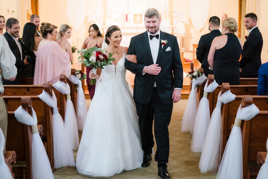 Bride and groom during their recessional at St. Charles Borromeo Catholic Church in Hampshire, IL