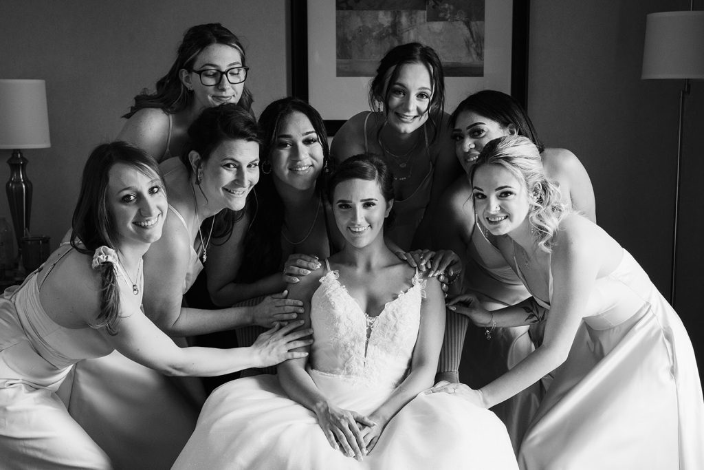 Bride with bridesmaids during bride prep at the Hampton Inn in St. Charles, IL