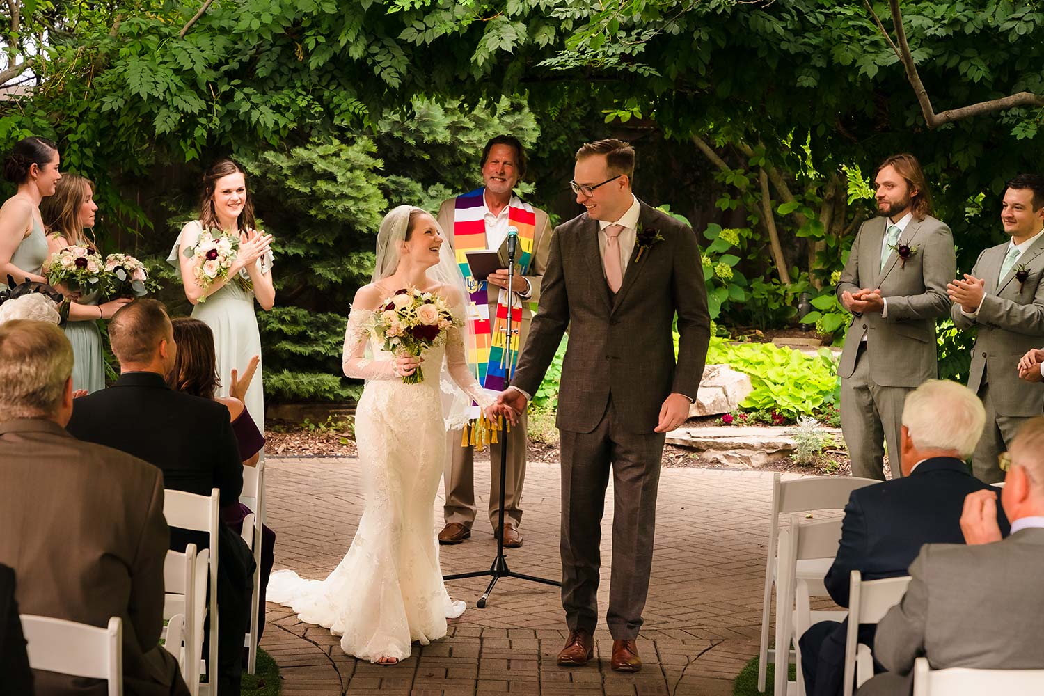 Bride and groom at their wedding ceremony in the Formal Garden at Wilder Mansion in Elmhurst, IL