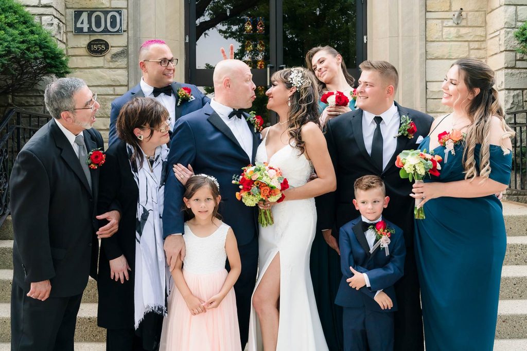 Bride and groom with families at the Center Church in Itasca, IL