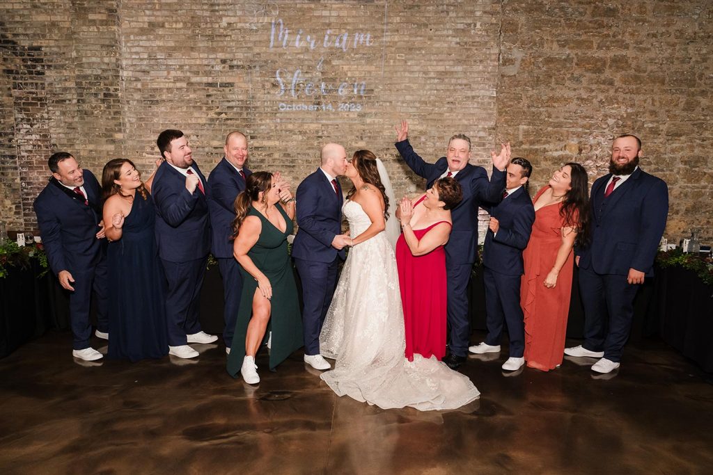 Bride and groom family portrait at Prairie Street Brewing Company in Rockford, IL