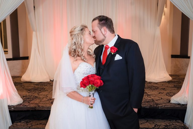 Bride and groom kissing portrait at Georgios Banquets in Orland Park, IL