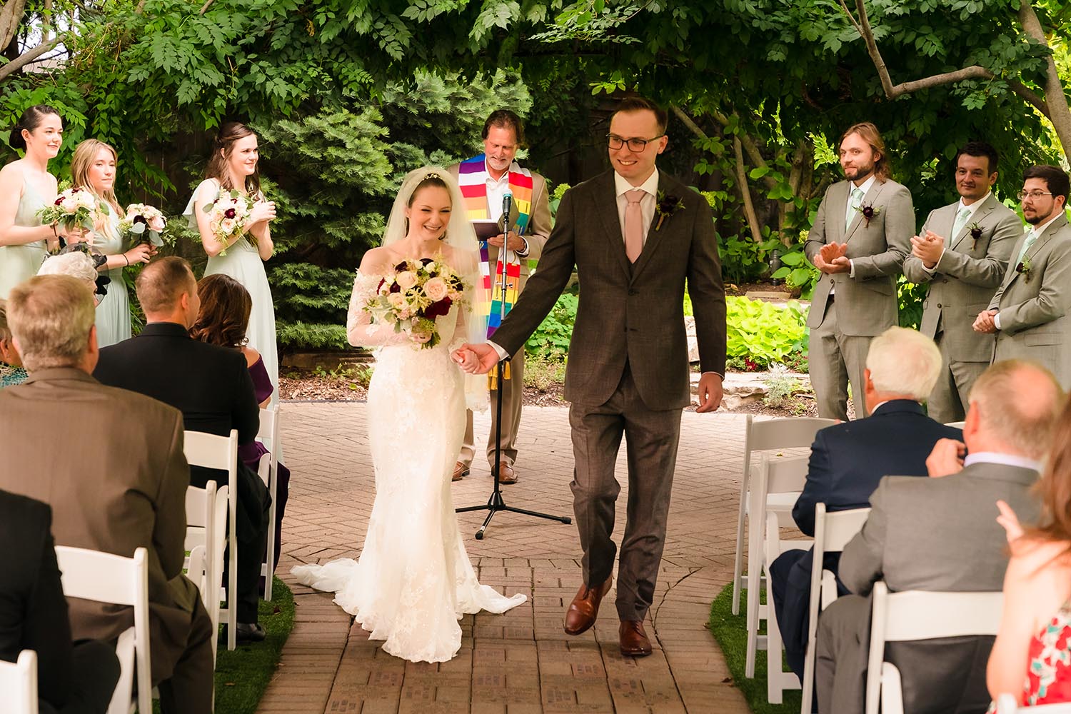 Bride and groom recessional at Wilder Mansion in Elmhurst, IL