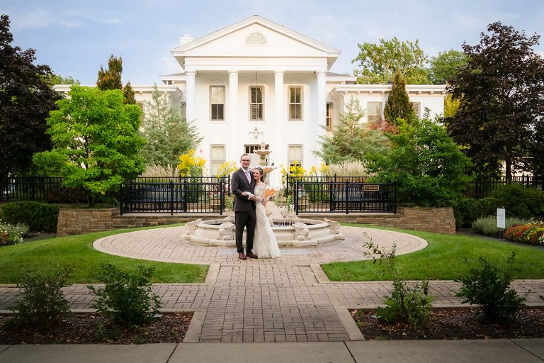 Bride and groom in front of Wilder Mansion in Elmhurst, IL