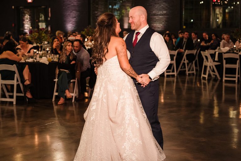 Bride and groom first dance during their reception at Prairie Street Brewing Company in Rockford, IL