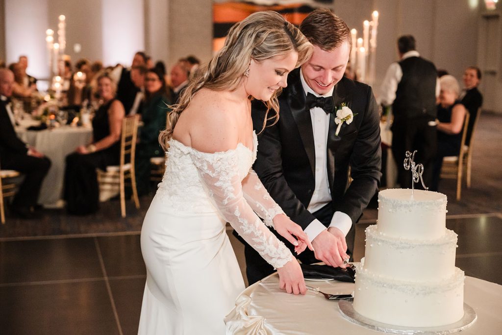 Bride and groom cutting their wedding cake at the Westin Chicago River North on New Year's Eve in Chicago, IL