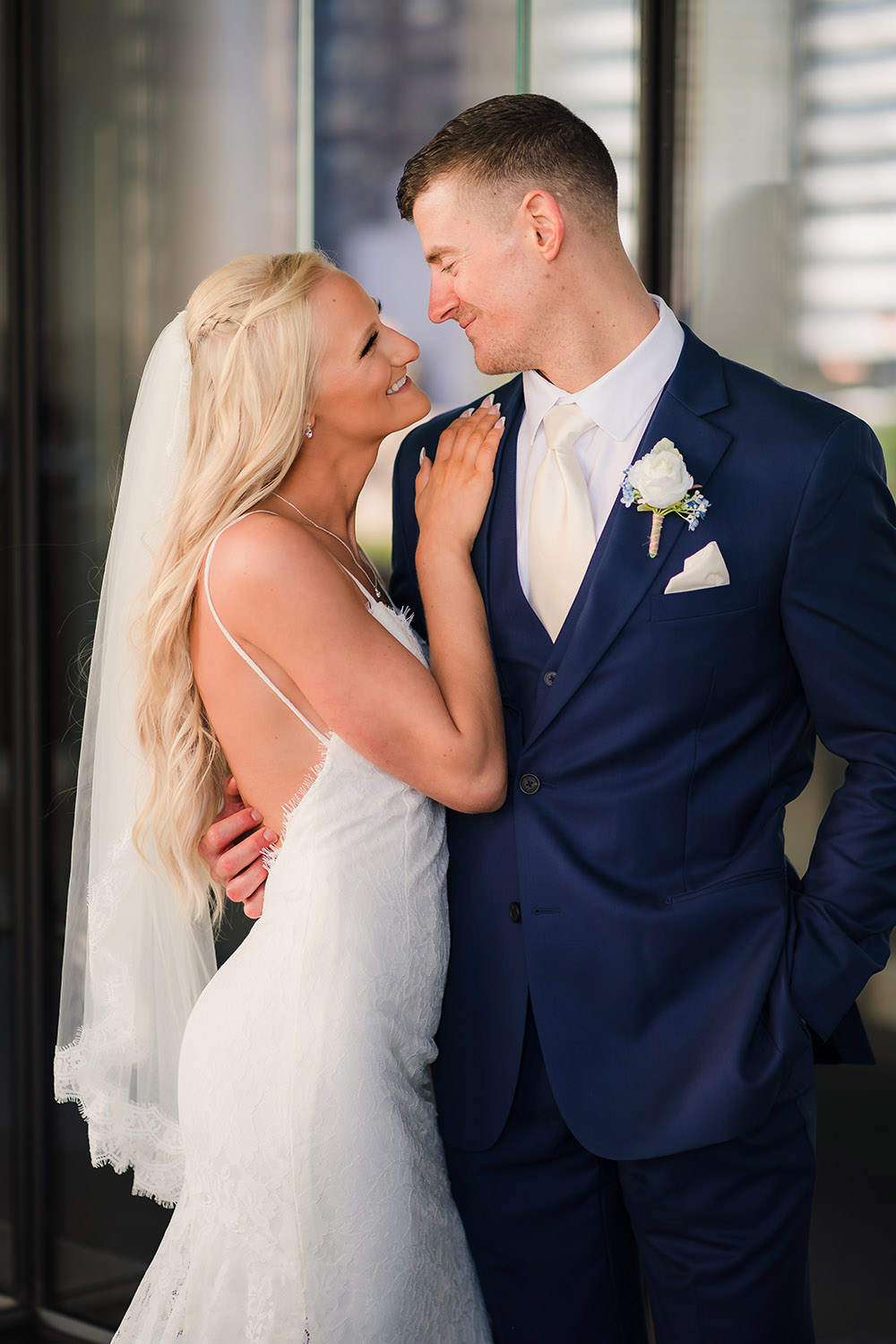 Bride and groom by Trump Tower in Chicago, IL