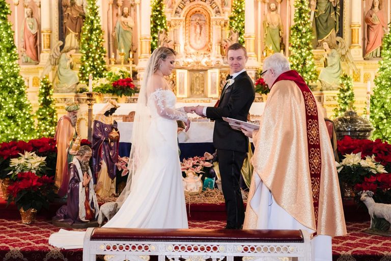 Groom enjoying the wedding ceremony at St. Michael Catholic Church in Chicago, IL