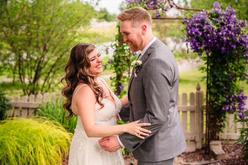 Bride and groom laugh during wedding portraits in Naperville, IL