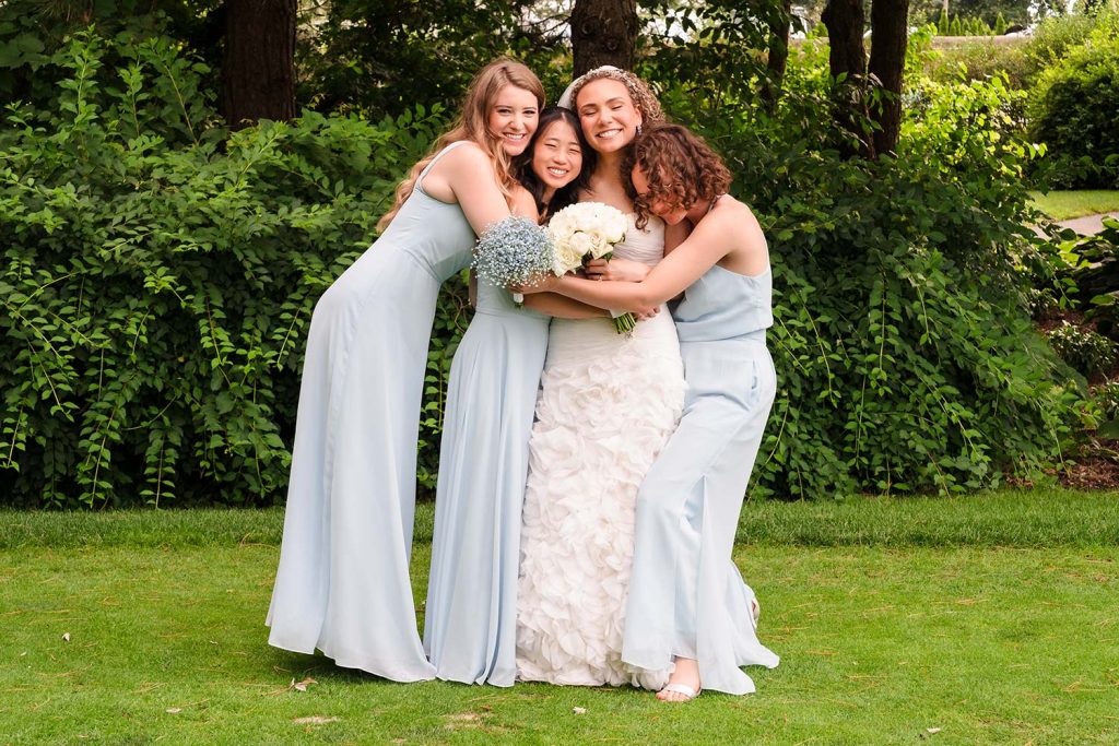 Bridesmaids love and support during the wedding party photos at Glen Flora Country Club in Waukegan, IL