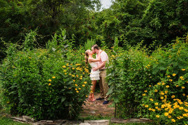 Engaged couple kissing at Ryerson Woods in Riverwoods, IL