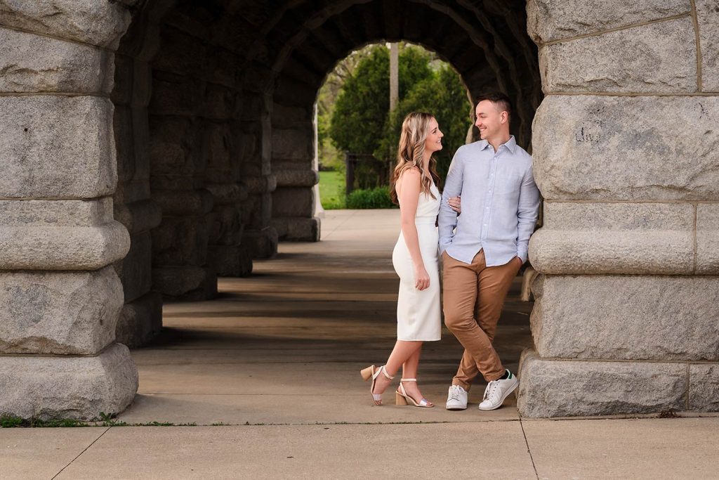 Engaged couple smiling at North Avenue Beach in Chicago, IL