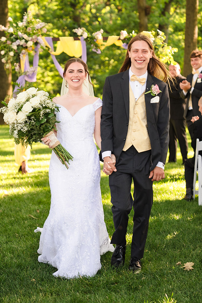 Bride and groom walk down the aisle at the end of their ceremony at the Monte Bello Estate in Lemont, IL