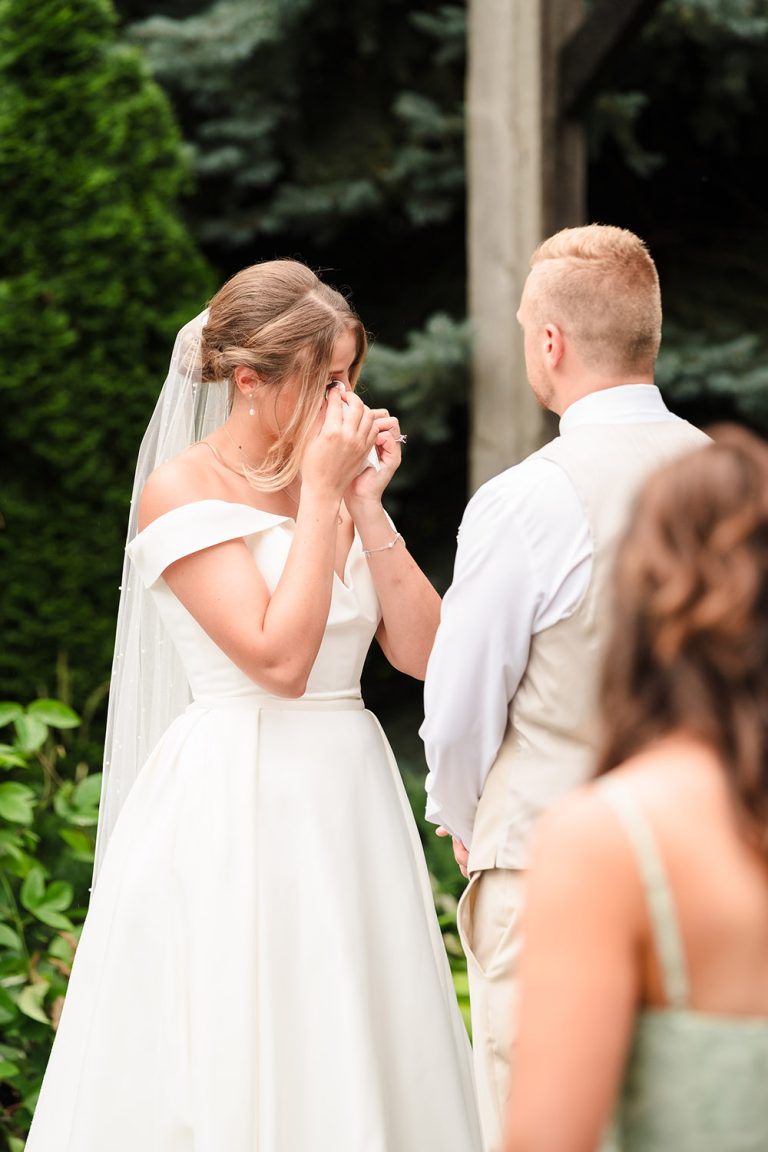 Bride cries tears of joy during her wedding ceremony at The Farmhouse in Plainfield, IL