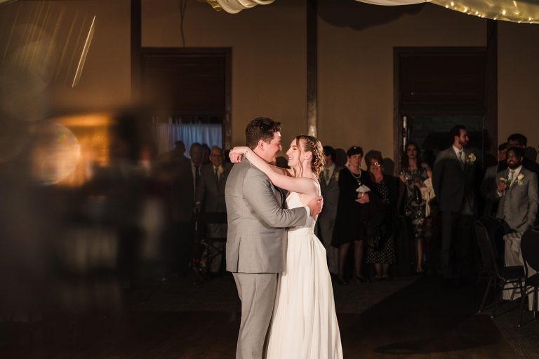 Bride and groom sharing their first dance at the Great Hall inside Starved Rock Lodge in Oglesby, IL