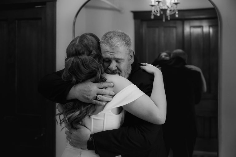 Father hugs his daughter during their first look at The Haight in Elgin, IL