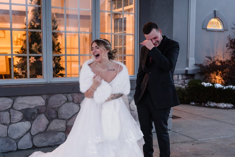 Bride and groom share a laugh together outside Aberdeen Manor Ballroom in Valparaiso, IN
