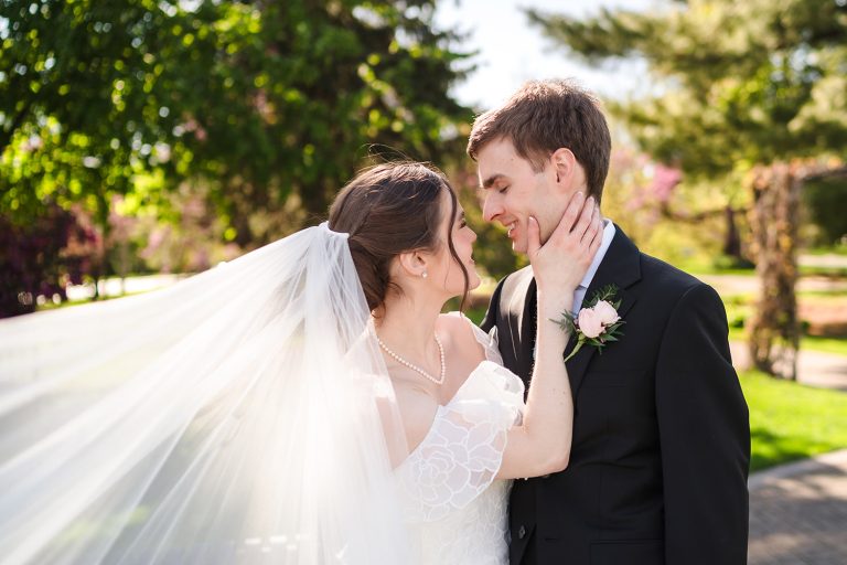 Bride and groom sharing a joyful wedding portrait at Wilder Park in Elmhurst, IL