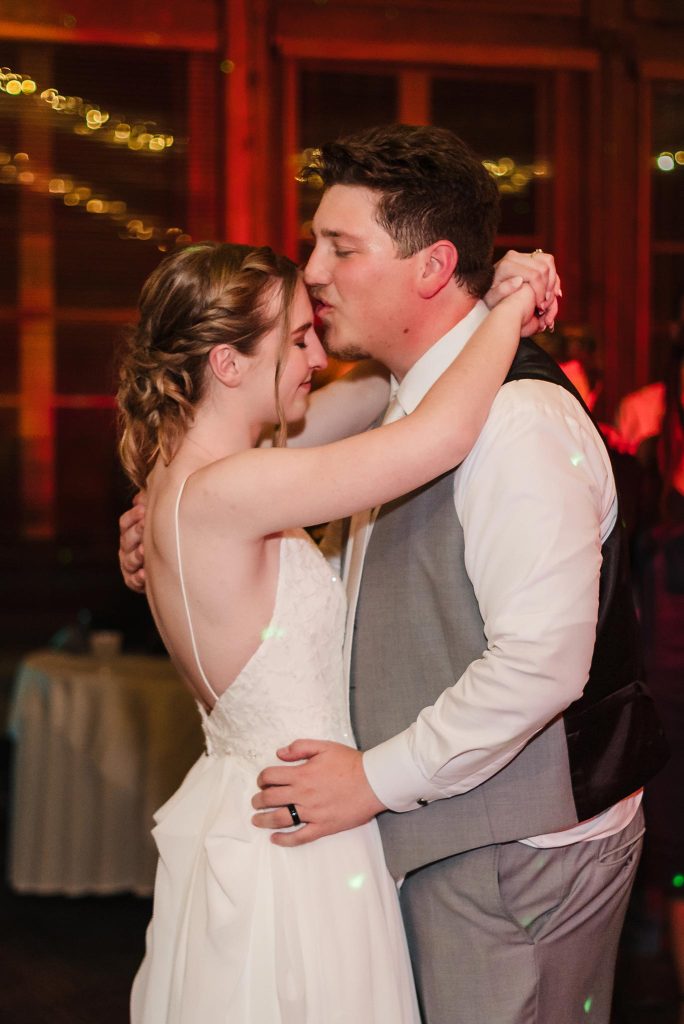 Bride and groom sharing an intimate last dance during their wedding reception at Starved Rock Lodge in Utica, IL