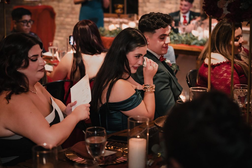 Guest reacts emotionally during a wedding reception speech at Riley and Joanna’s wedding at BRIX on the Fox in Carpentersville, IL